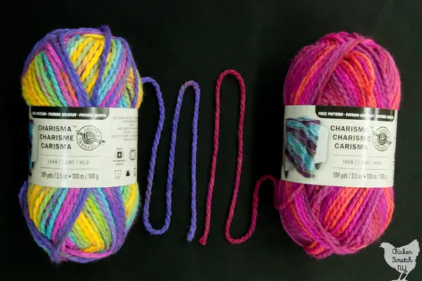 two balls of charisma yarn in the colors Bright Pop and Passion