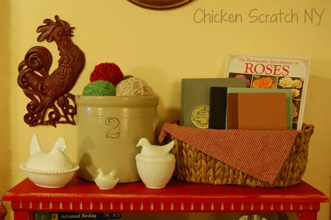 barn red bookcase, crock and milkglass chickens