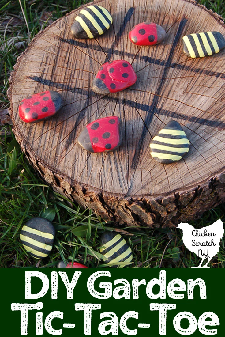wood stump with painted tic tac toe board with sontes painted like ladybugs and bumble bees for game pieces