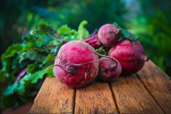 red beets on a wooden surface