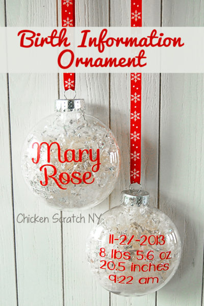 clear ornament filled with fake snow with red vinyl lettering for a childs name, birth date, birth weight, birth time and birth length