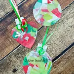 Get the kids involved with the decorating this holiday season with simple contact paper ornaments (no glue or glitter required!)