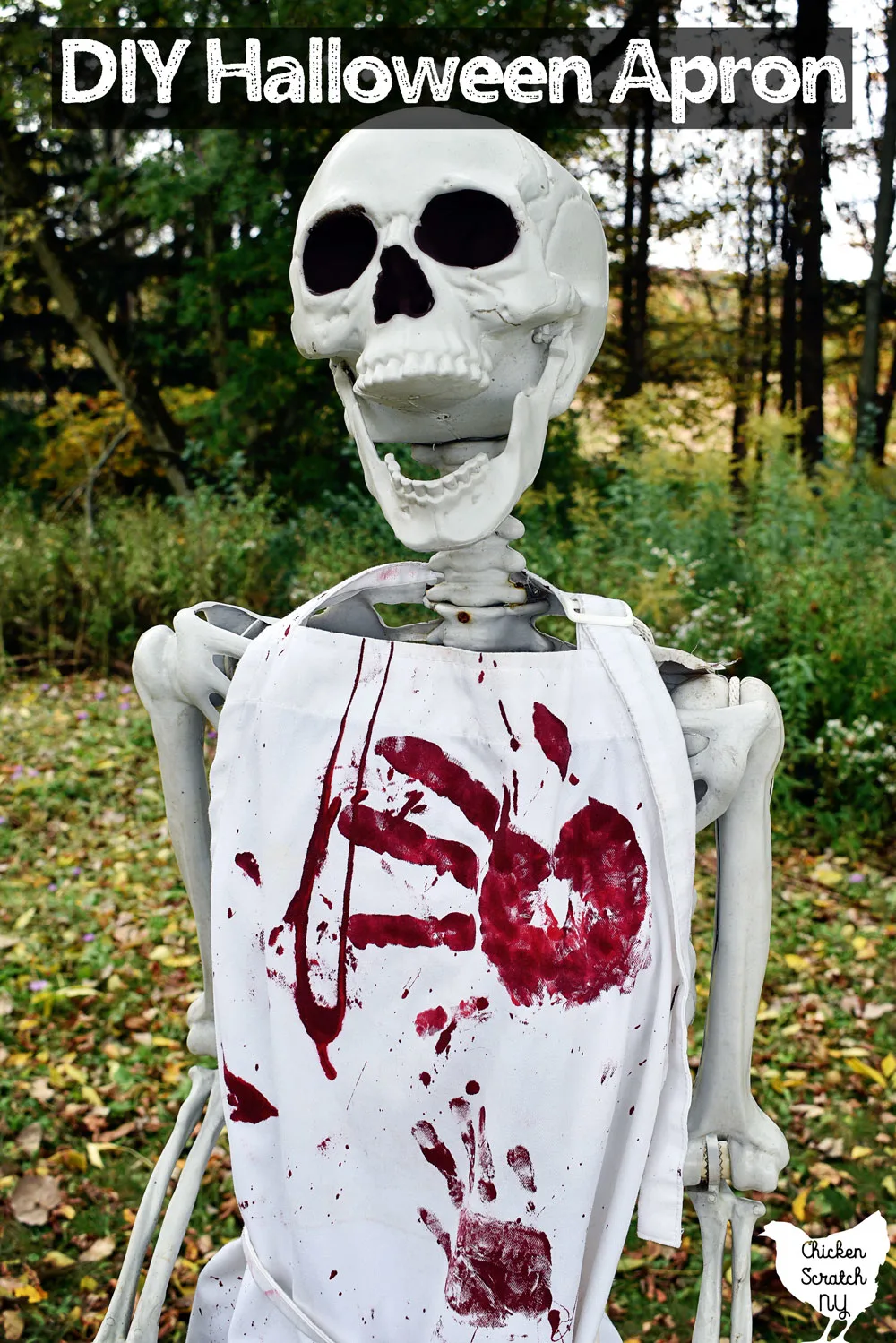 life sized Halloween skeleton wearing a white Bloody Halloween Apron