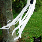 #10 can painted white with a black ghost face a nd white ribbon glued to the inside to make a Halloween ghost windsock