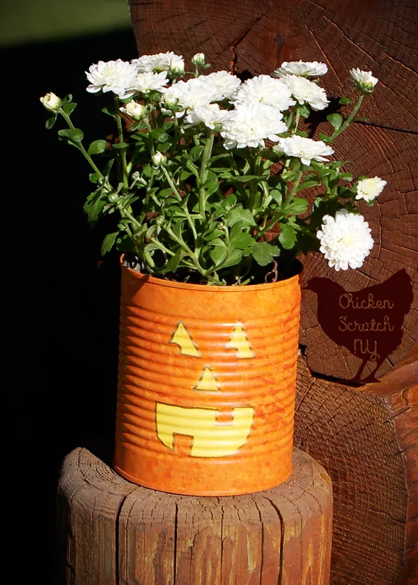 Whip up a set of Jack-O-Lantern Planters from tin cans this fall. Fill them with seasonal flowers for a fun pop of color on your front porch