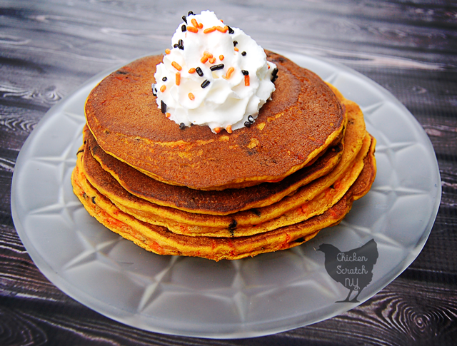 Pumpkin, Spice & everything nice come together for a Halloween breakfast treat of pumpkin pancakes jazzed up with black & orange sprinkle confetti