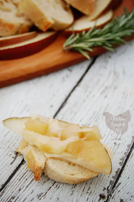 Top a round of warm baked brie with a chunky pear sauce made with fresh rosemary and honey. Serve with crusty bread or pear slices.