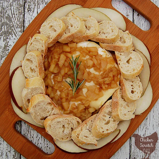 Top a round of warm baked brie with a chunky pear sauce made with fresh rosemary and honey. Serve with crusty bread or pear slices.