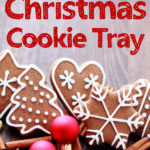 hazy wooden surface holding red Christmas bulbs and fancy gingerbread cookies decorated with white royal icing red text overlay 6 tips for a perfect Christmas cookie tray