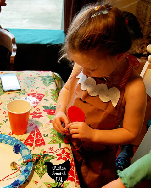 Entertain the little ones with a Holiday Cookie Party! Decorate giant Christmas Tree Cookies and keep the fun going with jingle bell necklaces and stickers