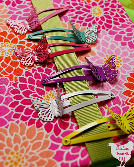 Stop finding hair bows everywhere and corral the in one pretty place with a DIY Hair Bow Holder. Pick a fabric to match the room and grab your hot glue gun, you'll be done in no time! 