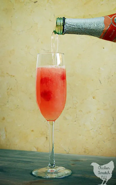 Celebrate with a Raspberry Peach Mimosa full of fresh flavors and bubbles! If a classic mimosa and a peach Bellini made a baby this would be it