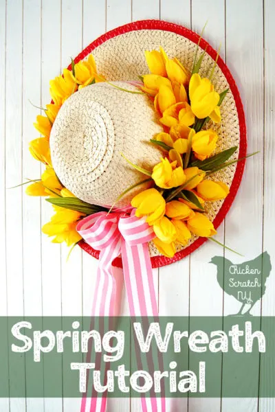 sun hat turned into a apring wreath with yellow tulips and pink striped ribbon