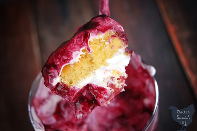 spoonful of summer berry trifle with lemon pound cake, strawberries and blueberries