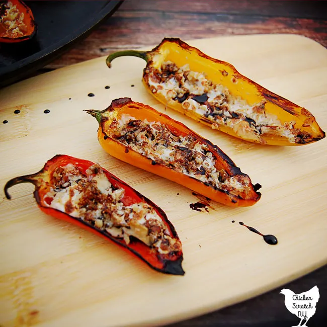 red, orange and yellow pepper filled with chicken and melted mozzarella cheese