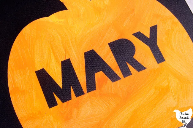 pumpkn painted on a canvas with the name Mary painted in black