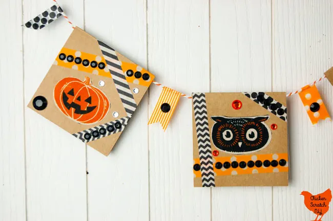 close up of Halloween banner card with owl face, jack o lantern, orange and black washi tape and rhinestones