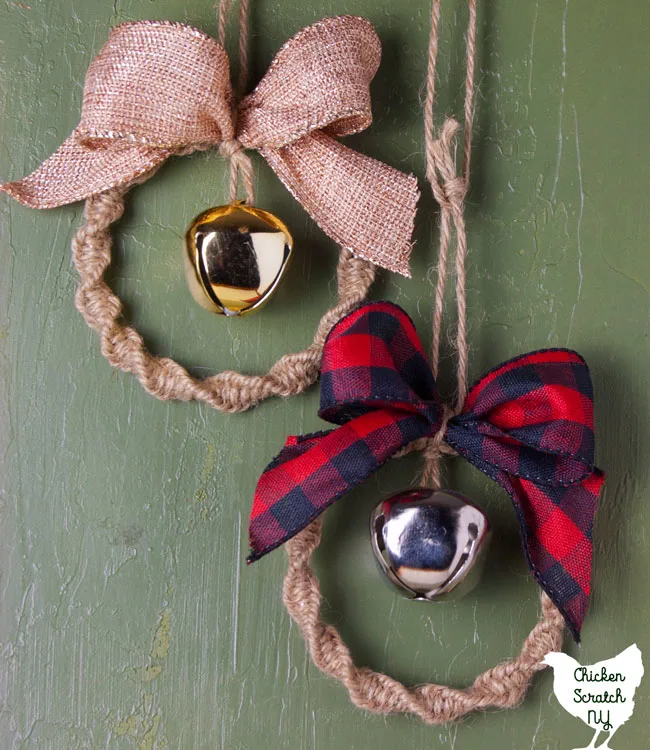 two macrame wreath ornaments made with twine, jingle bells and metallic burlap ribbon or buffalo check ribbon