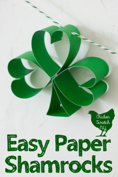 paper shamrock hanging from green and white striped twine