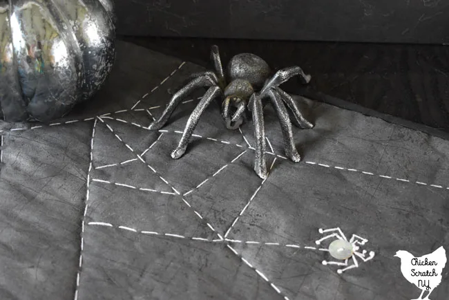 hand embroidered spiderweb table runner with button spiders