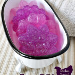bathtub soap dish filled with pink and purple holographic glitter M&P soap bars