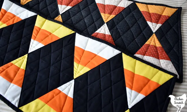 60 degree quilting ruler candy corn table runners in bright solids and muted autumn prints