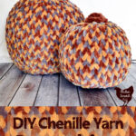 two fake pumpkins covered with chenille yarn braids held on by straight pins for DIY fall home decor