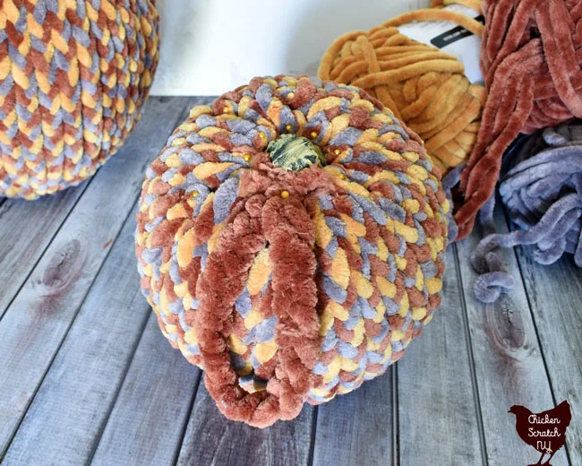 adding a yarn stem cover to a fake chenille yarn pumpkin