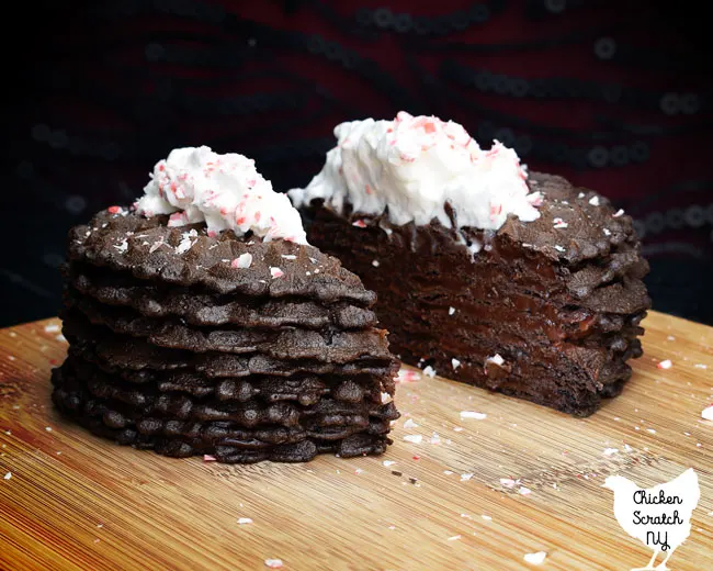 cross section view of a chocolate peppermint ice box cake showing the cookie and pudding layers