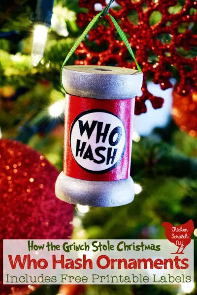 wooden spool ornament hanging in a Christmas tree with a homemade label saying "Who Hash"