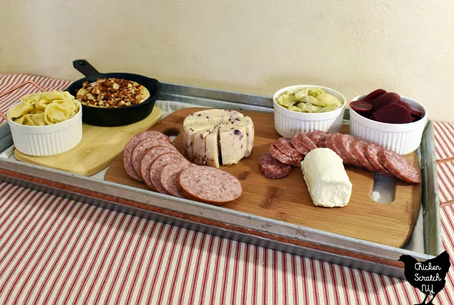 add sliced cured meat to the charcuterie tray