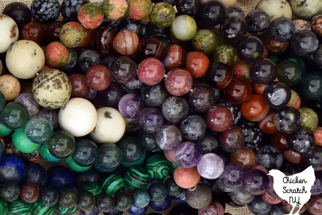 aemiprecious stone beads made into necklaces in a large pile