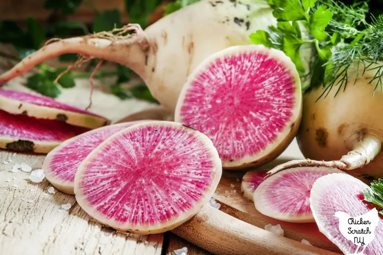 sliced watermelong radish on a cutting board