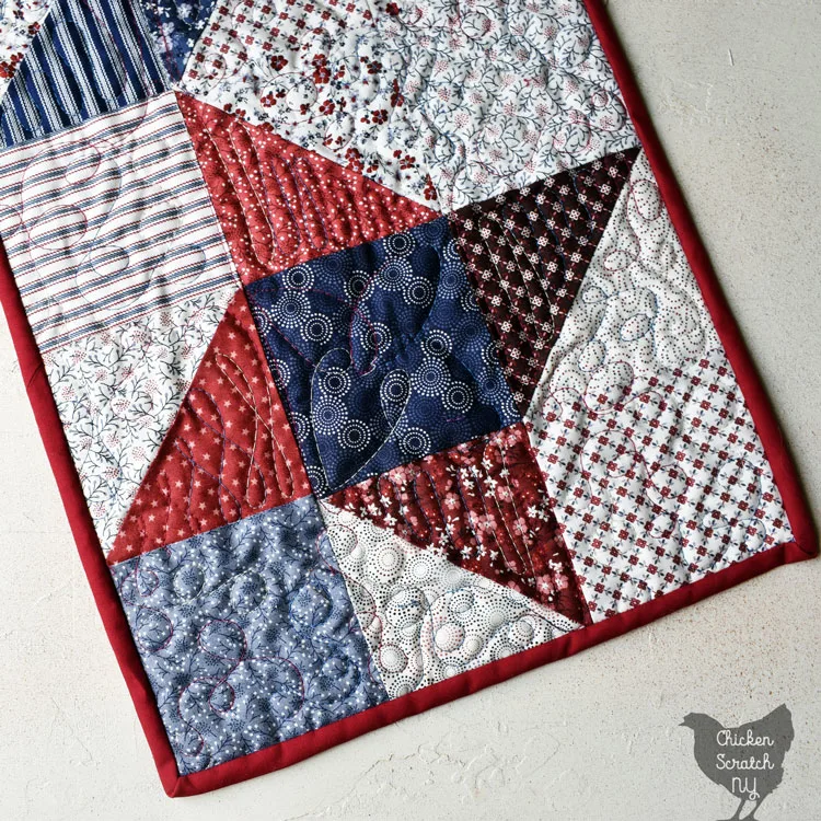 close up view of friendship star made with red, white and blue charm squares