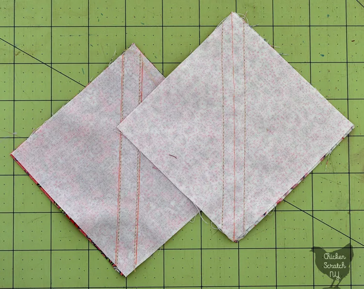two squares with diagonal lines and two stitching lines to make half square triangles