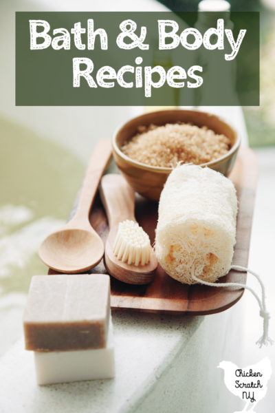 wooden bowl with bath salts, soap and a loofa with text overlay bath & body recipes