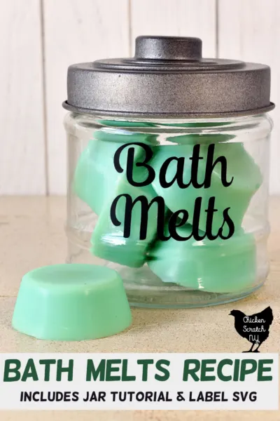 glass jar with black lid and black vinyl text "Bath Melts" in a script font filled with green bath melts with text overlay "bath melts recipe with jar tutorial"