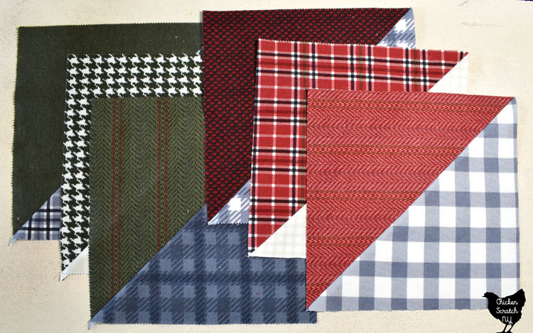 large half square triangle quilt blocks made with green, red, grey and cream flannel