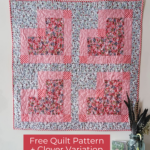 wall quilt made with 4 hearts sewn from pink and white floral prints