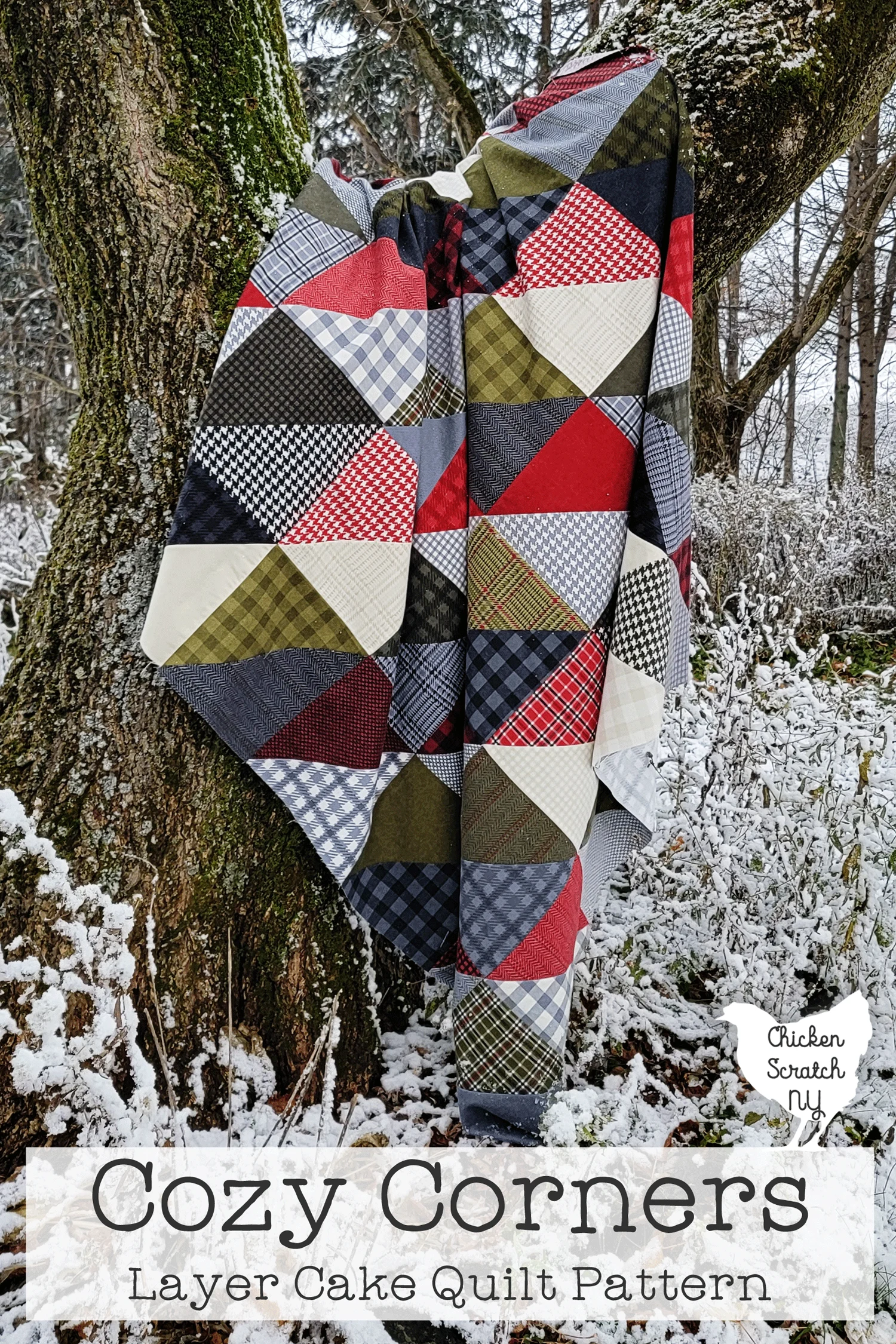 cozy corners quilt sewn with red, green, cream and gray flannel displayed in a tree surrounded by snow with text overlay "cozy corners layer cake quilt pattern"