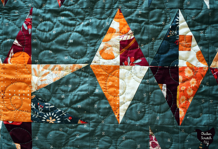 close up view of black diamond quilt made with Season & Spice from Art Gallery Fabrics