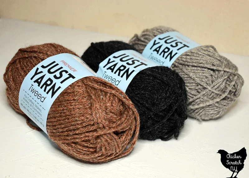 three skeins of Just Yarn Worsted in rust, charcoal and greige