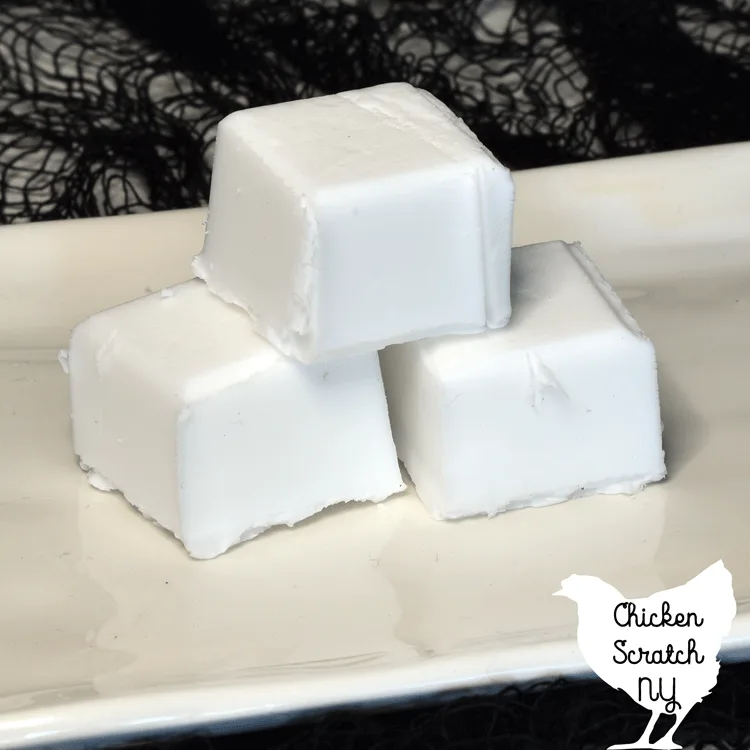 blocks of white melt and pour soap base on a white plate