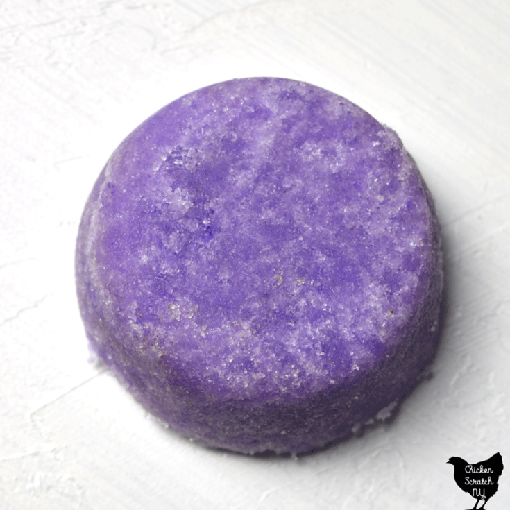 purple round sugar scrub bar made in a silicone muffin pan