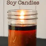 lit 8oz jelly jar candle with dark orange wax