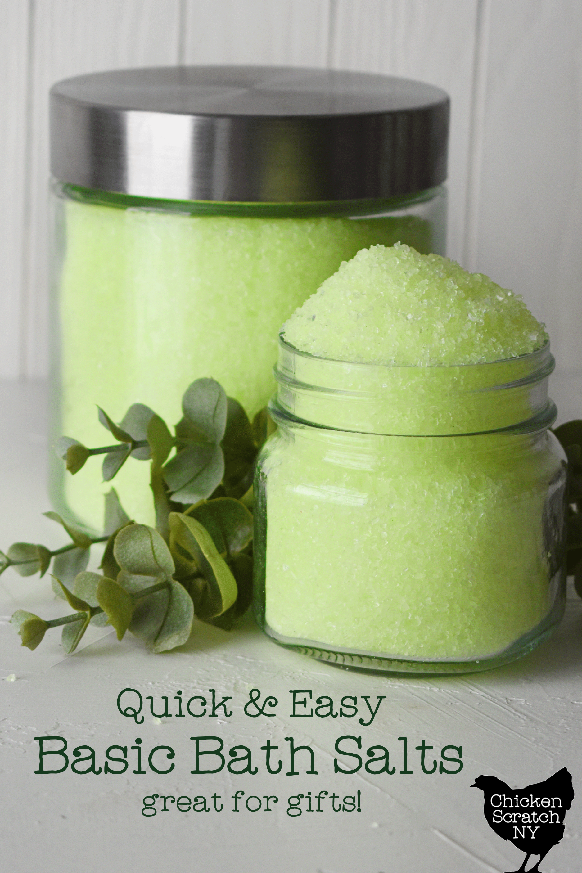 two glass jars holding lime green bath salts on a white surface