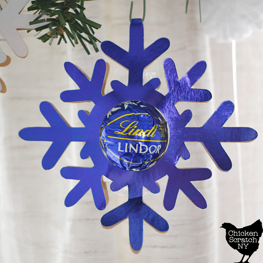 closer up shot of blue lindt truffle snowflake ornament
