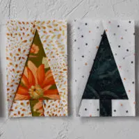 four foundation paper pieced tiny tree blocks, throww showing the front and one showing the back